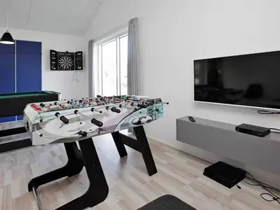 a large glass table in a room with a pool table at Luxury Spa Retreat by Sea in Vrist