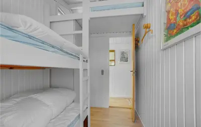 two bunk beds in a room with a hallway at Holiday Home Saltum Doggerbanke in Saltum