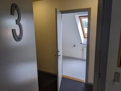 a bathroom with a door with the number on it at Sevel Kro in Vinderup