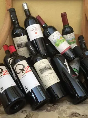 a bunch of wine bottles sitting on a table at Næsbydale Badehotel in Ranum
