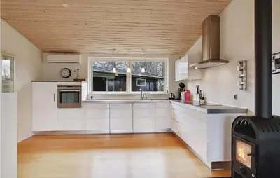 a kitchen with white cabinets and a stove at Awesome Home In Vinderup With Wifi in Vinderup