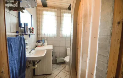 a bathroom with a sink and a toilet at Three-Bedroom Holiday Home In Spottrup in Spottrup