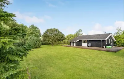 a home with a large yard with a shed at Two-Bedroom Holiday Home In Logstor in Løgstør