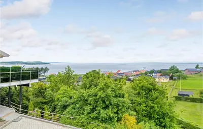 a view of the ocean from the balcony of a house at Three-Bedroom Holiday Home In Farso in Farsø