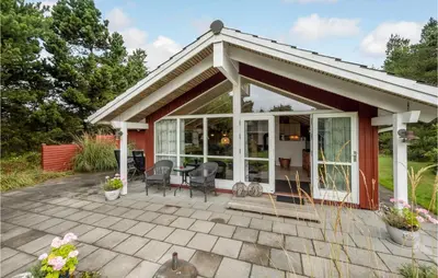 a pavilion with a table and chairs on a patio at Three-Bedroom Holiday Home In Hurup Thy in Sindrup