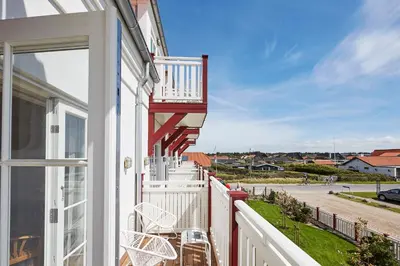 a balcony with a view of a street at Strandhotellet in Blokhus