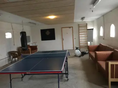 a ping pong table in a living room with a ping pong ball at B & B Langagergaard in Thisted