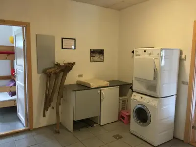 a kitchen with a washing machine and a washer at B & B Langagergaard in Thisted