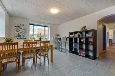 a dining room with a table and chairs at B & B Langagergaard in Thisted