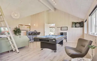 a room with a pool table and a ladder at Seven-Bedroom Holiday Home In Spottrup in Spottrup