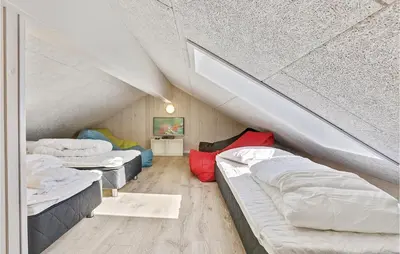 a room with three beds in a attic at Seven-Bedroom Holiday Home In Spottrup in Spottrup