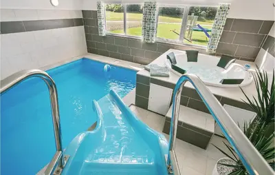 a swimming pool with a tub and a sink in a bathroom at Seven-Bedroom Holiday Home In Spottrup in Spottrup