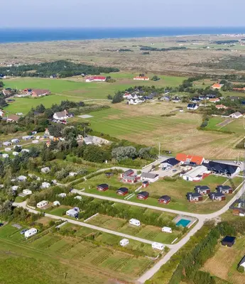 an aerial view of a small town with houses at Stenbjerg Kro & Badehotel in Snedsted