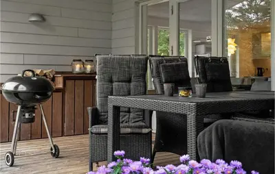 a dining room with a table and chairs at Four-Bedroom Holiday Home In Spottrup in Spottrup
