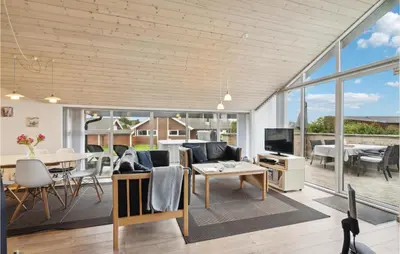a living room with a couch and a table at Three-Bedroom Holiday Home In Vinderup in Vinderup