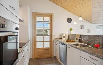 a kitchen with a sink and a counter top at Three-Bedroom Holiday Home In Vinderup in Vinderup