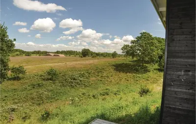 a view of a field from a house at Three-Bedroom Holiday Home In Skals in Skals