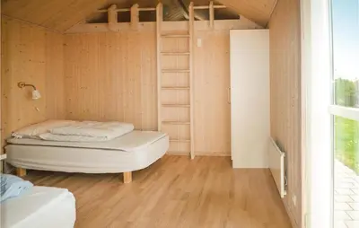 a small room with a bed and a window at Three-Bedroom Holiday Home In Fjerritslev in Fjerritslev