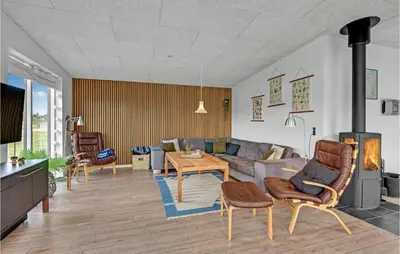 a living room with a couch and a table at Three-Bedroom Holiday Home In Spottrup in Spottrup