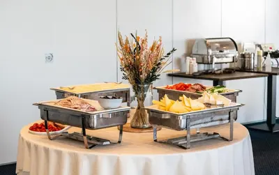 a table with three trays of food on it at Hotel Limfjorden in Thisted