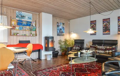 a living room with a couch and a table at Two-Bedroom Holiday Home In Pandrup in Pandrup