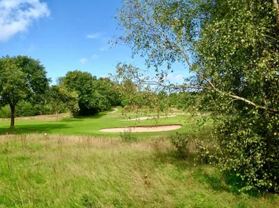 a view of a golf course in a field at Sebber Kloster in Nibe