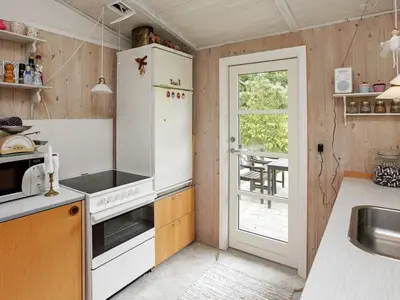 a kitchen with a white refrigerator and a sink at 4 person holiday home in Højslev in Højslev