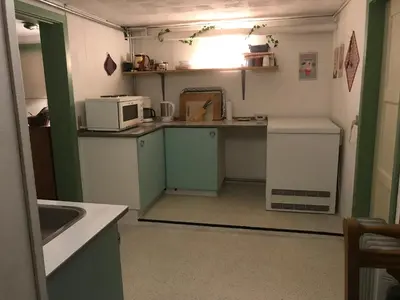 a small kitchen with a sink and a microwave at Glyngøre Bed & Breakfast in Glyngøre