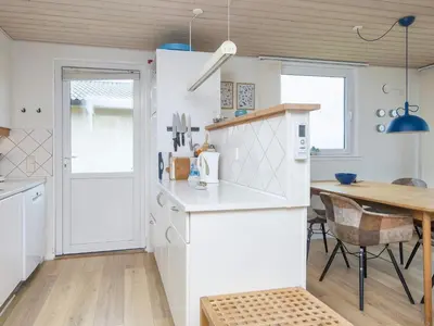 a kitchen and dining room with a table at 5 person holiday home in Lemvig-By Traum in Trans