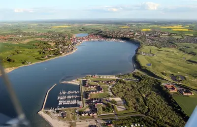 an aerial view of a large river with a harbor at Hotel Lidenlund in Lemvig