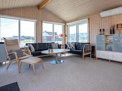 a living room with a couch and a table and chairs at Luxury Spa Retreat near Sea - By Traum Ferienwohnungen in Ferring