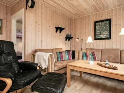 a living room with two couches and a coffee table at 6 person holiday home in Lemvig in Ferring