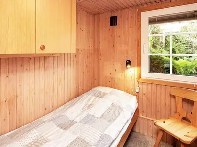 a small room with a bed and a window at 4 person holiday home in Struer in Struer