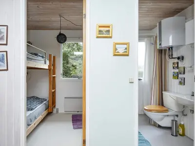 a small bathroom with a sink and a toilet at 8 person holiday home in Struer-By Traum in Struer