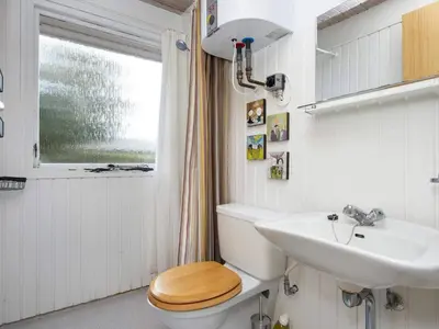 a bathroom with a toilet and a sink at 8 person holiday home in Struer-By Traum in Struer