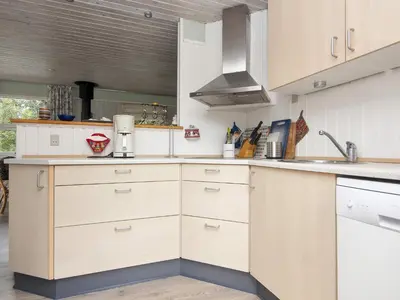 a kitchen with white cabinets and a sink at 8 person holiday home in Struer-By Traum in Struer