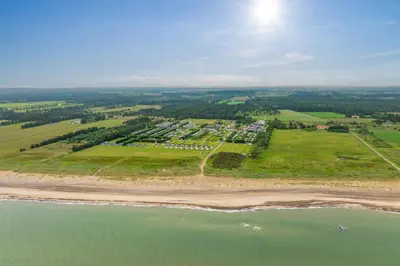an aerial view of a resort on the beach at First Camp Klim Strand - Nordvestkysten in Fjerritslev