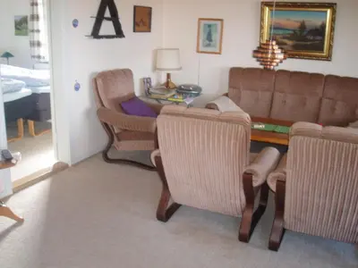 a living room with a couch and chairs and a table at Glyngøre Bed & Breakfast II in Glyngøre