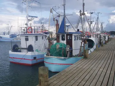 two boats docked at a dock in the water at Glyngøre Bed & Breakfast II in Glyngøre