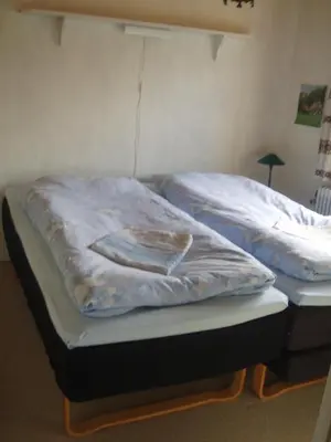 a bed with a blanket on top of it at Glyngøre Bed & Breakfast II in Glyngøre