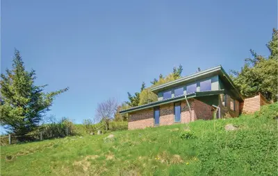 a house on the side of a hill at Three-Bedroom Holiday Home In Struer in Struer