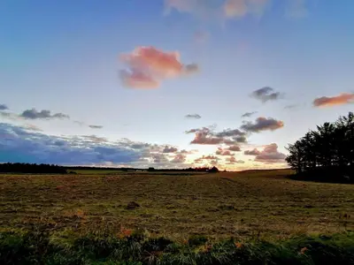 an open field with a cloudy sky in a field at 10 person holiday home in Løkken-By Traum in Løkken