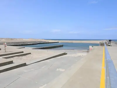 a walkway leading down to the beach with water at 4 person holiday home in Thisted-By Traum in Nørre Vorupør