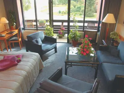 a living room with a couch and a table at Sallingsund Færgekro in Nykøbing Mors