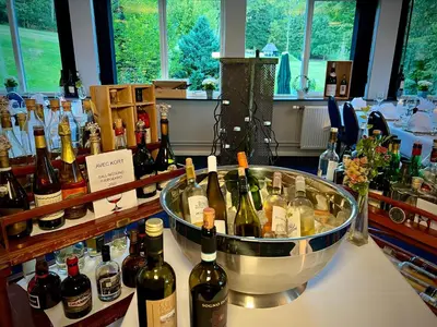 a bunch of bottles of wine on a counter at Sallingsund Færgekro in Nykøbing Mors