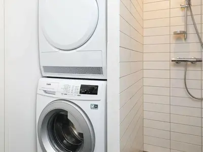 a washing machine in a bathroom with a mirror at 8 person holiday home in Saltum-By Traum in Saltum