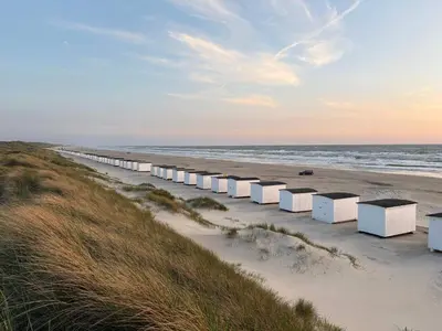 a long line of white containers on a beach at 10 person holiday home in Løkken-By Traum in Løkken