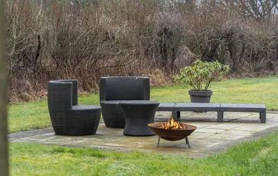 three chairs and a table and a fire pit at Three-Bedroom Holiday Home In Vestervig in Vestervig