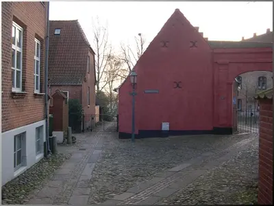a red building with crosses on the side of it at Klosterpensionen in Viborg