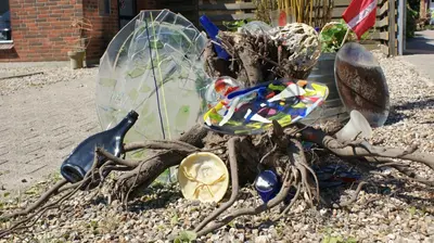 a group of glass umbrellas sitting on a tree branch at Apartment med udsigt over Nordmors in Sejerslev